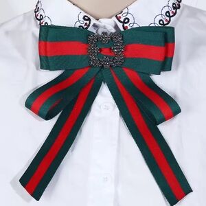 Elegant Green and Red Bow Brooch